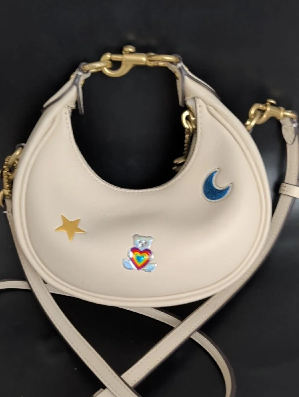 Cream Mini Crescent Crossbody Bag with Playful Patch Motifs
